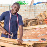 Local,African,Carpenter,At,Work,Smiling